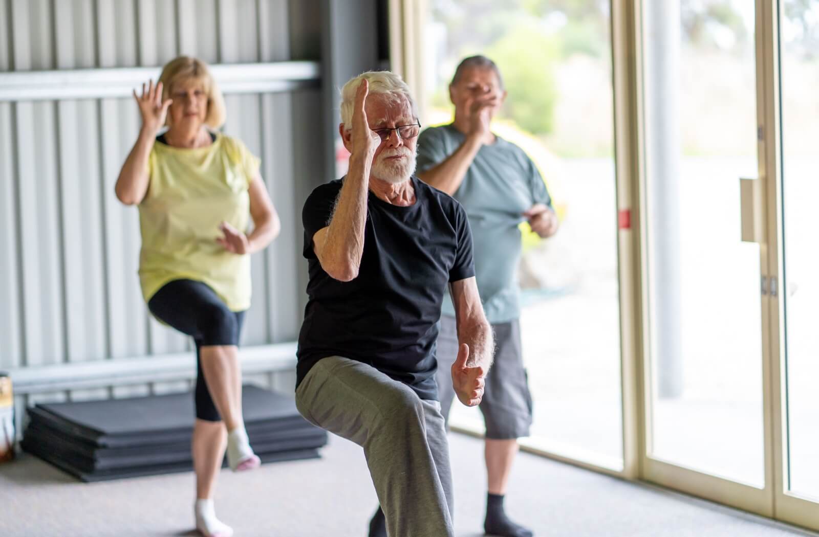 A group of older adults exercising together.