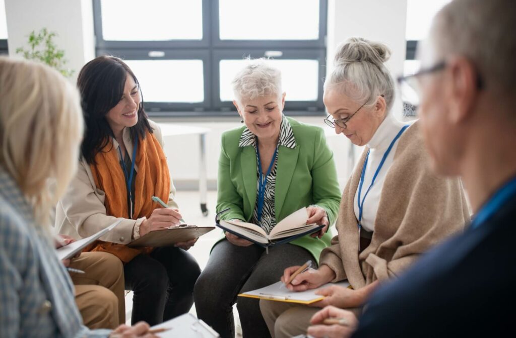 A group of older adults discuss a classic book together in book club